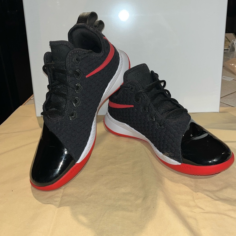 black and gray lebrons